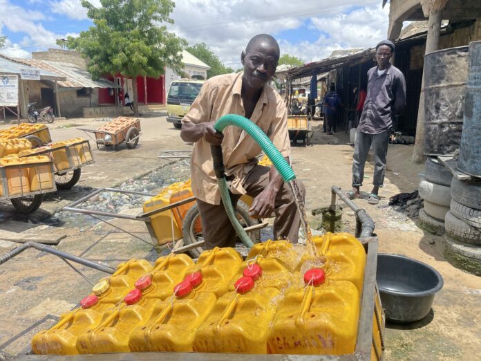 Adaamu Bala Water vendor scaled 1