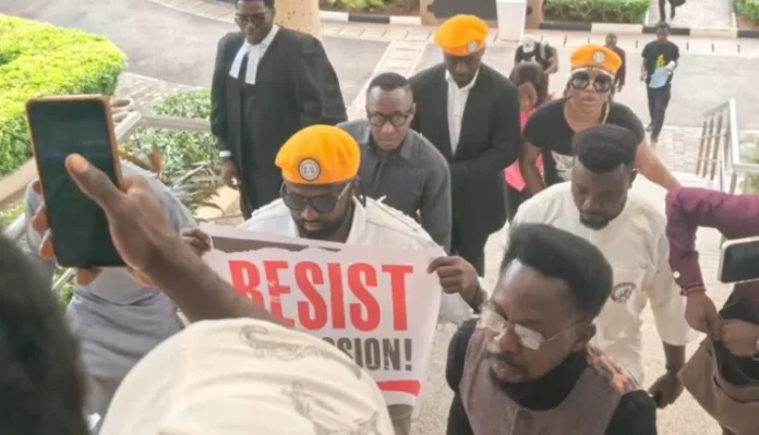Omoyele Sowore at the middle being accompanied by members of his group into the Federal High Court in Abuja on Monday 750x430